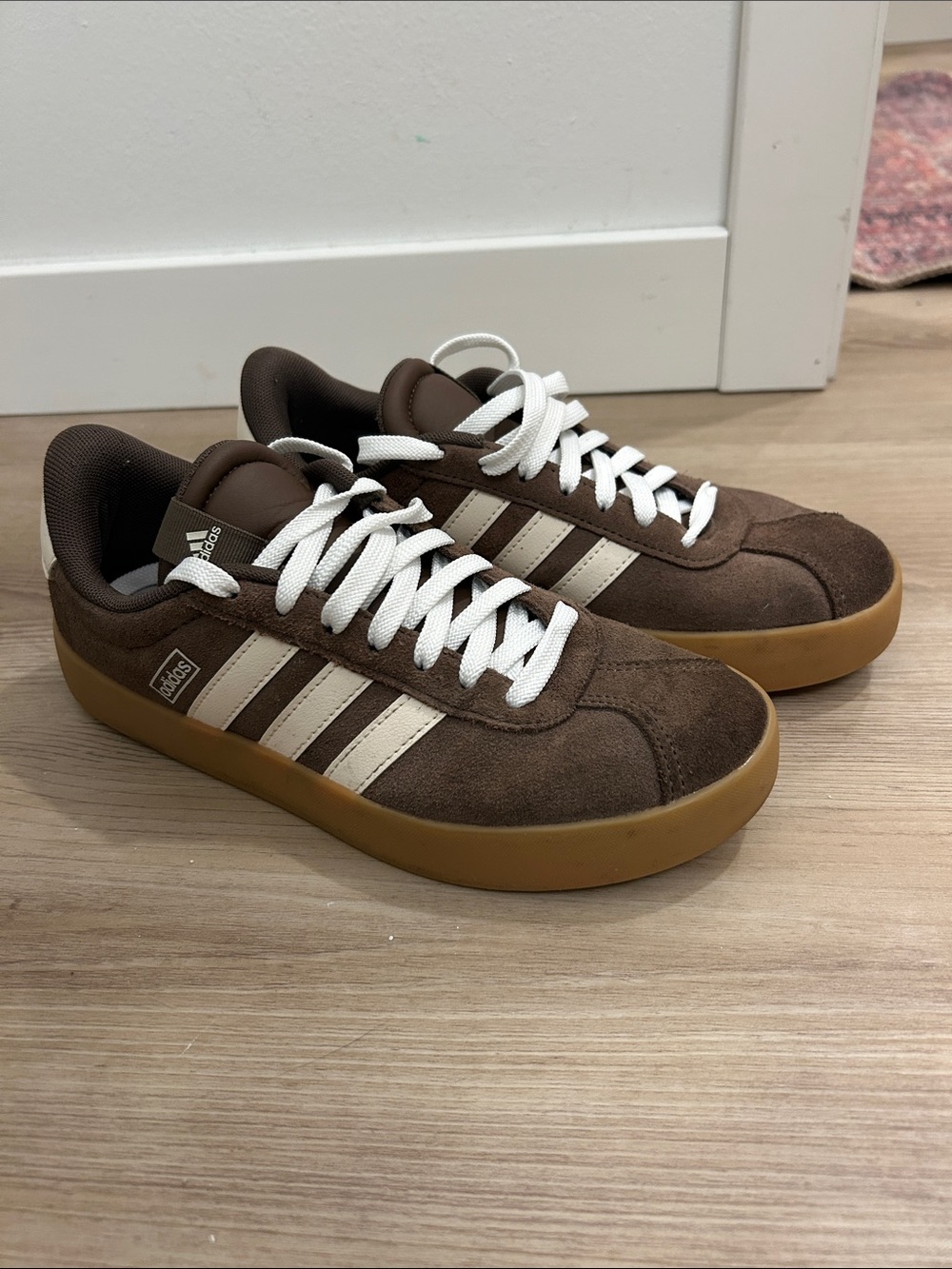 adidas women’s Brown Suede Sneakers with White Stripes